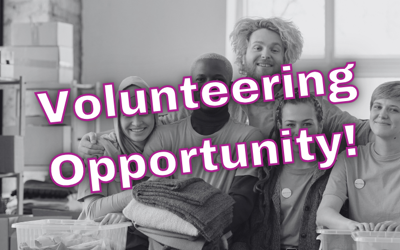 Group of people facing the camera and smiling. The words Volunteering Opportunity are written over the image.