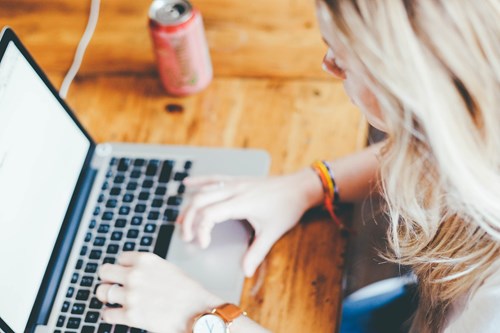 woman typing on a laptop