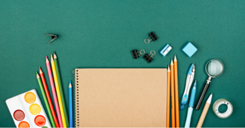 Green background with notepad and pens on top