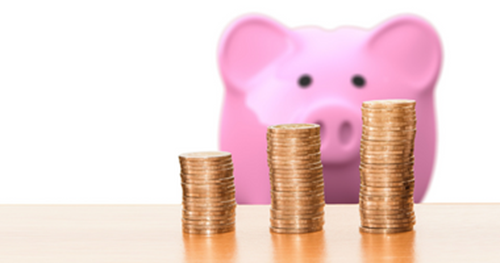 Piggy bank looking at three stacks of coins
