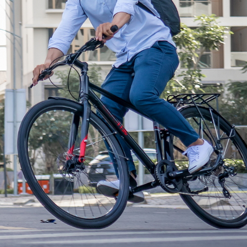 Person riding a bicycle to work.