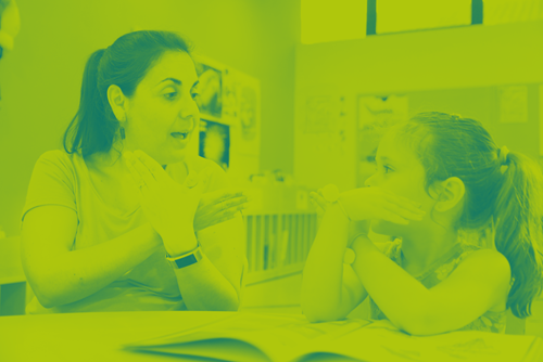 women and young girl talking in sign language