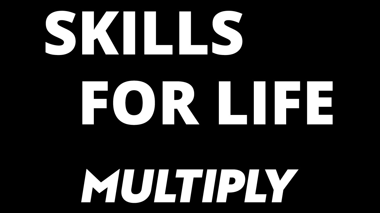 White Skills for Life Multiply logo on a black background.